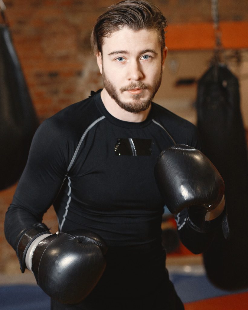 boxer-in-black-gloves-at-the-gym-L7X54YR.jpg